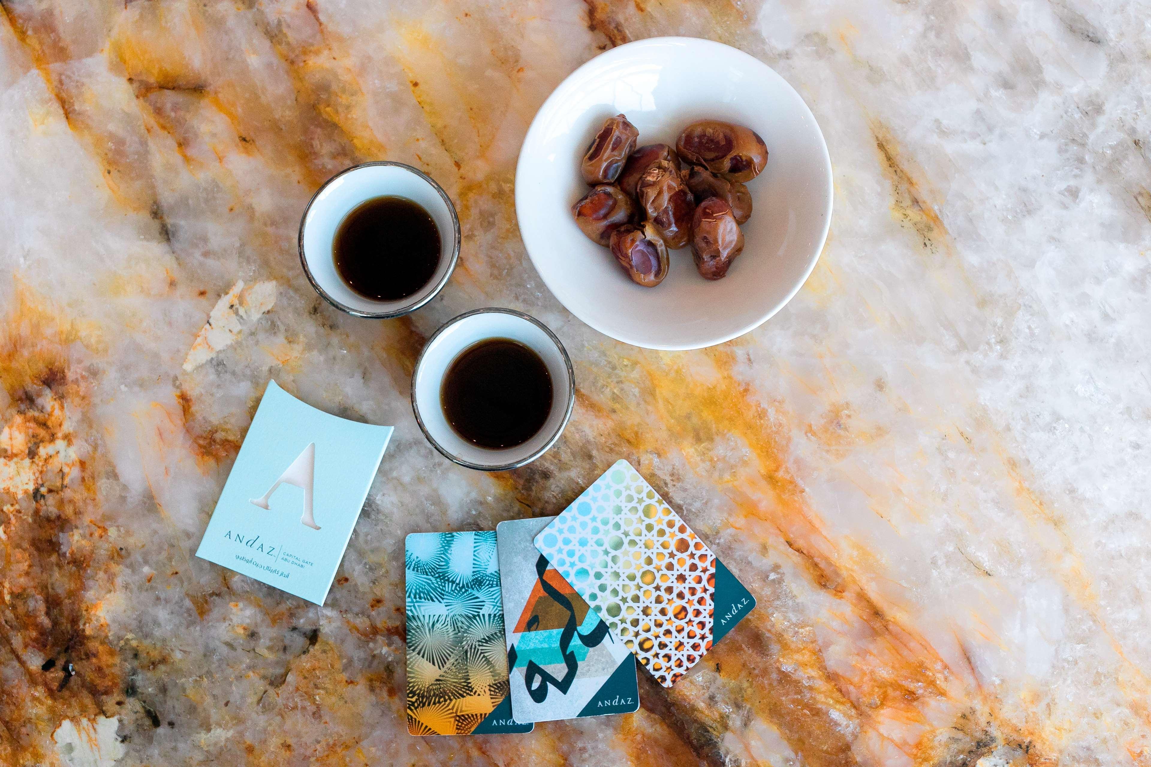 Andaz Capital Gate Abu Dhabi, By Hyatt Hotel Luaran gambar A cup of coffee with a bowl of dates
